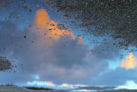 February 12: Skypuddle by Hänsel & Gretel. 'When we visited Denmark the weather changed every hour. After a strong rain the sun appeared again. I took this picture of a dramatic cloud reflected in a puddle.'