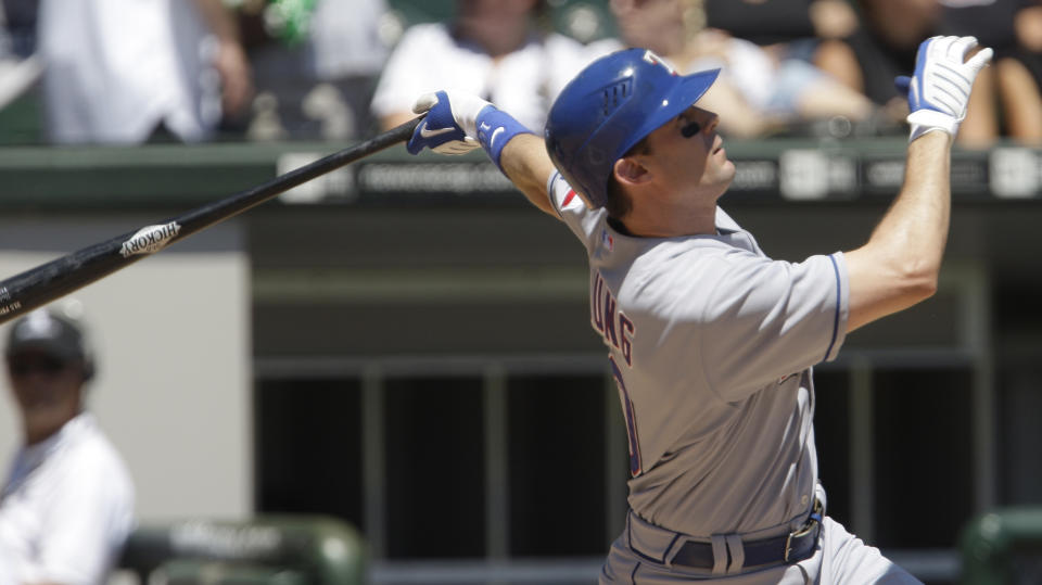 Texas Rangers' Michael Young hits a solo home run against the Chicago White Sox during the first inning of a baseball game Wednesday, July 23, 2008, in Chicago. (AP Photo/M. Spencer Green)