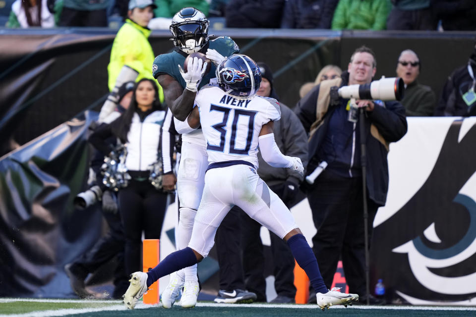 Philadelphia Eagles' A.J. Brown scores a touchdown in front of Tennessee Titans' Tre Avery during the second half of an NFL football game, Sunday, Dec. 4, 2022, in Philadelphia. (AP Photo/Matt Rourke)