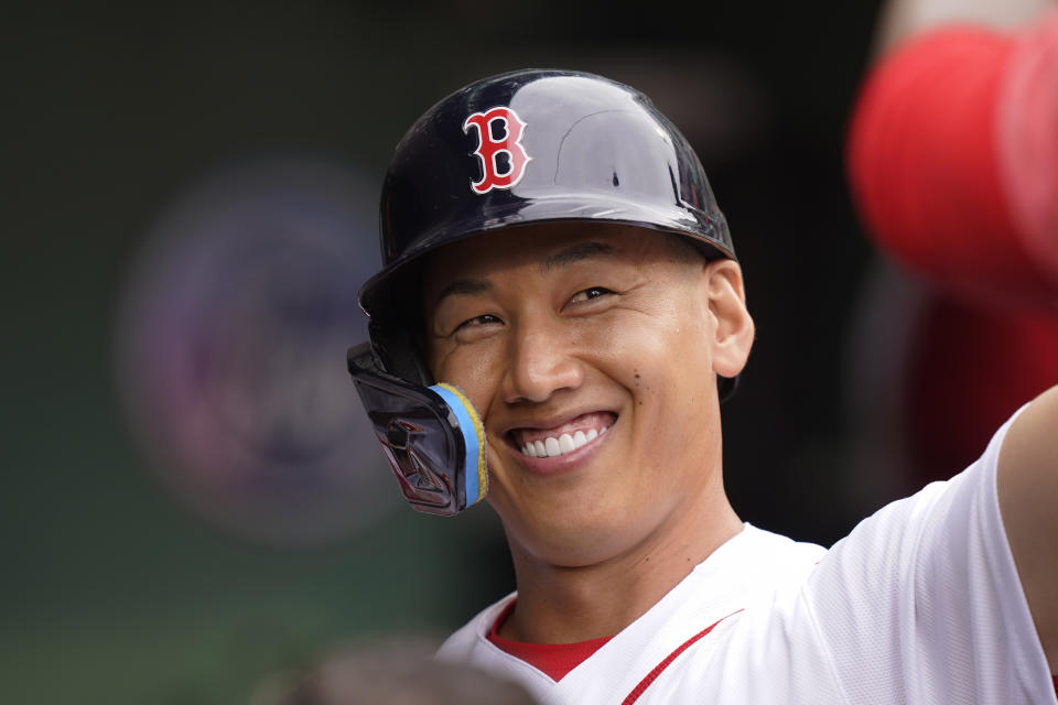 Boston Red Sox's Masataka Yoshida celebrates in the dugout after scoring on a double by Christian Arroyo in the sixth inning of a baseball game against the Oakland Athletics, Sunday, July 9, 2023, in Boston. (AP Photo/Steven Senne)