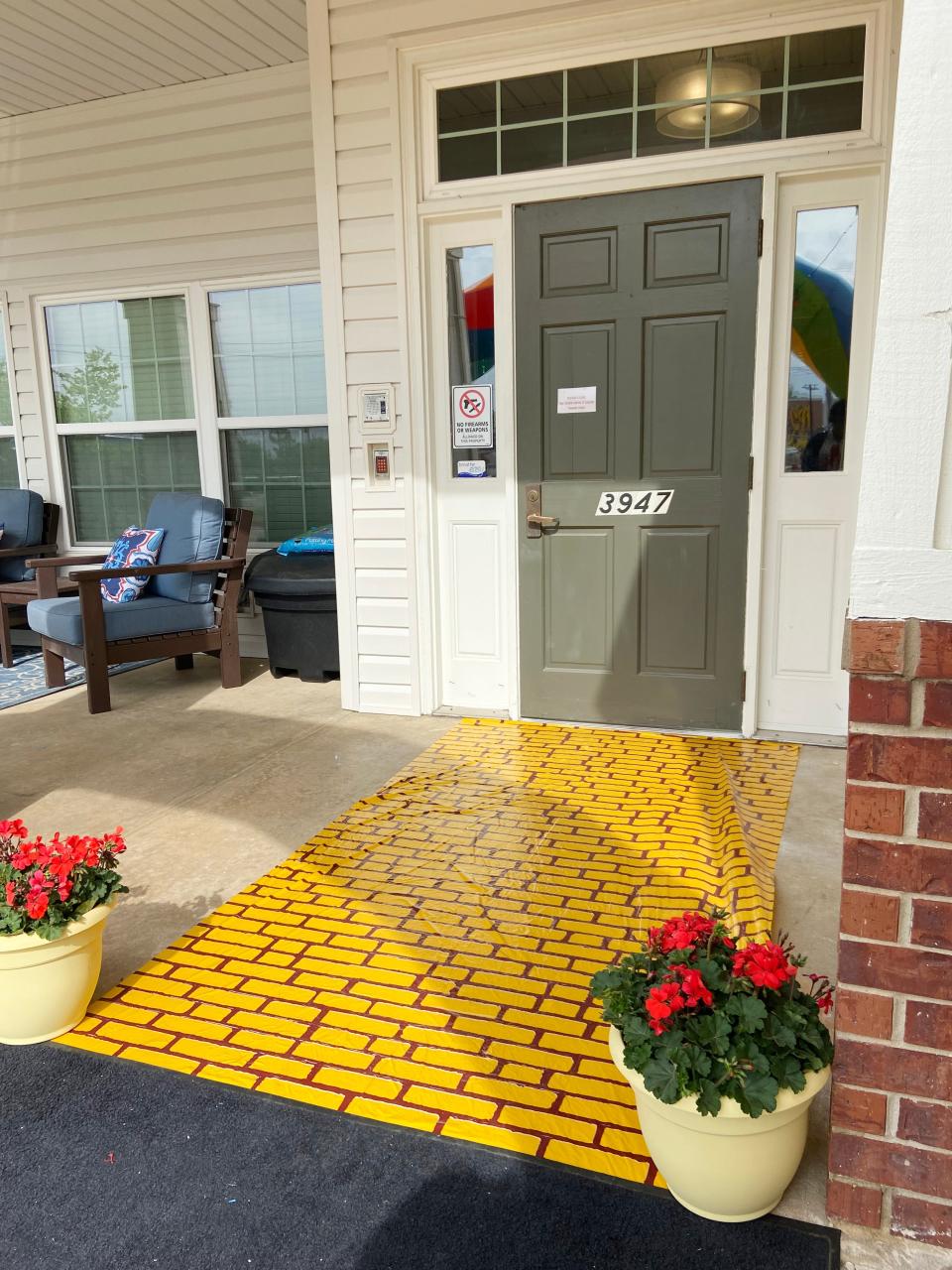 A yellow brick road leads visitors inside Brookdale Shawnee assisted living center as residents and staff commemorated the one-year anniversary of a tornado that struck the facility and other portions of Shawnee.