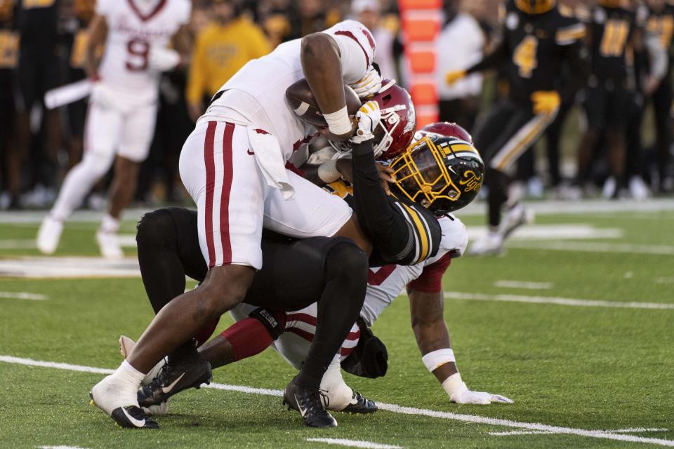 Arkansas quarterback KJ Jefferson, left, is sacked by Missouri 's Martez Manuel during the third quarter of an NCAA college football game Friday, Nov. 25, 2022, in Columbia, Mo. (AP Photo/L.G. Patterson)