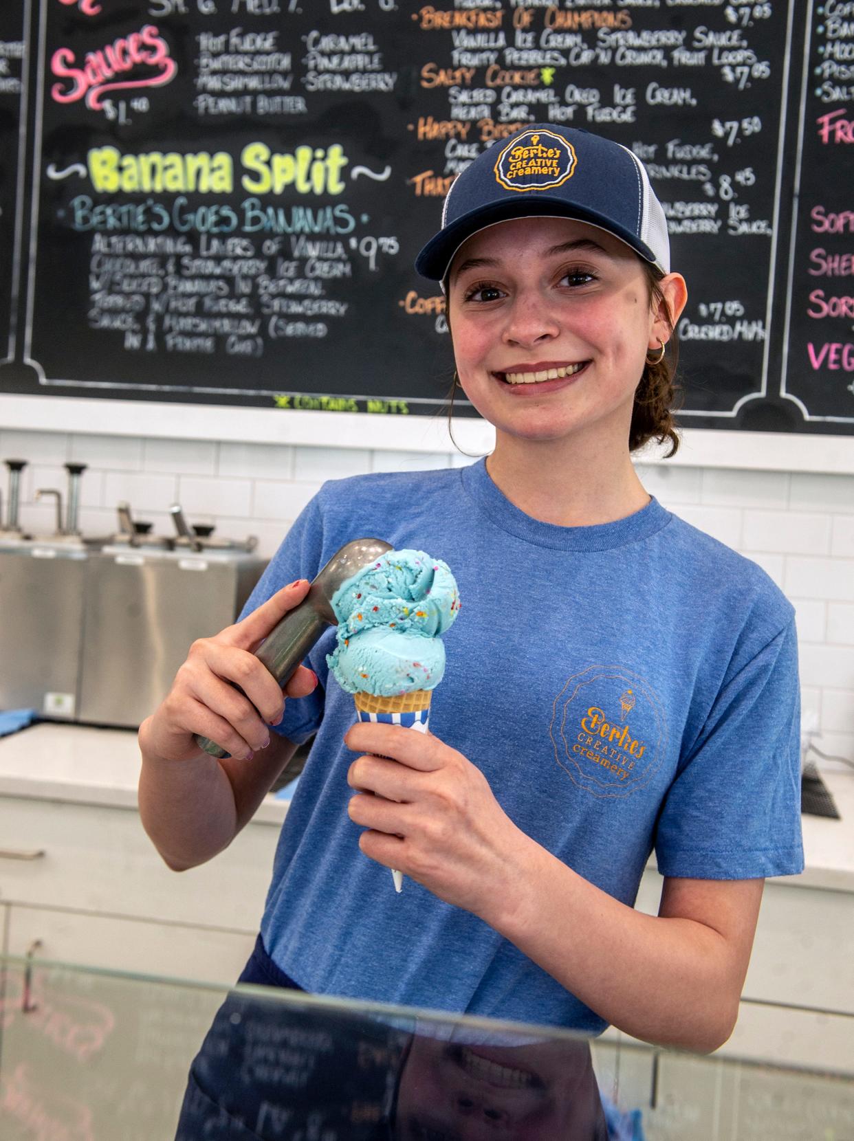 At Bertie's Creative Creamery in Milford, Judy Claro scoops up a cotton candy ice cream cone, April 17, 2024.
