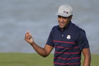 Team USA's Tony Finau reacts after making a putt during a four-ball match the Ryder Cup at the Whistling Straits Golf Course Friday, Sept. 24, 2021, in Sheboygan, Wis. (AP Photo/Jeff Roberson)