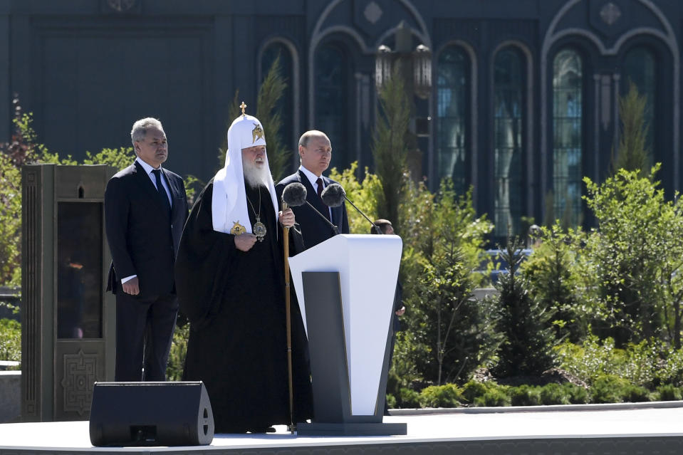 Russian Orthodox Church Patriarch Kirill, center, delivers his speech as Russian President Vladimir Putin, right, and Russian Defense Minister Sergei Shoigu stand near after a religion service marking the 79th anniversary of the Nazi invasion of the Soviet Union, at the Cathedral in the Patriot Park outside Moscow, Russia, Monday, June 22, 2020. The country's new Cathedral of Russian Armed Forces was built and dedicated to the Soviet victory in World War II. (Alexei Nikolsky, Sputnik, Kremlin Pool Photo via AP)