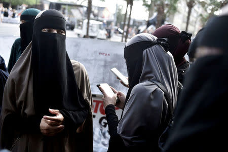 Women in niqabs gather before a demonstration against the Danish face veil ban in Copenhagen, Denmark August 1, 2018. Mads Claus Rasmussen/Ritzau Scanpix/via REUTERS