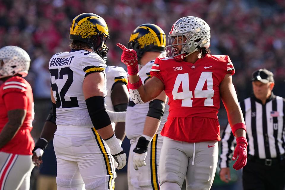 Nov 26, 2022; Columbus, Ohio, USA;  Ohio State Buckeyes defensive end J.T. Tuimoloau (44) points out a false start by \m52o\ during the first half of the NCAA football game at Ohio Stadium. Mandatory Credit: Adam Cairns-The Columbus Dispatch