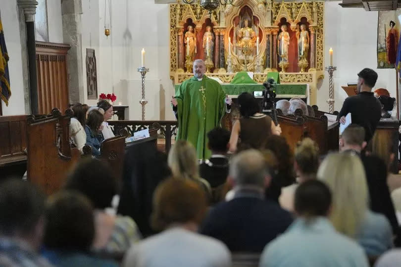 Father Stevenson delivers a sermon to members of the public attending a morning service and vigil at St James's church in Bushey, following the deaths of Carol Hunt, 61, the wife of BBC Five Live racing commentator John Hunt, and two of their daughters, Hannah, 28, and Louise, 25, who were killed in a crossbow attack at their home, on Tuesday in Bushey, Hertfordshire. Picture date: Thursday July 11, 2024.