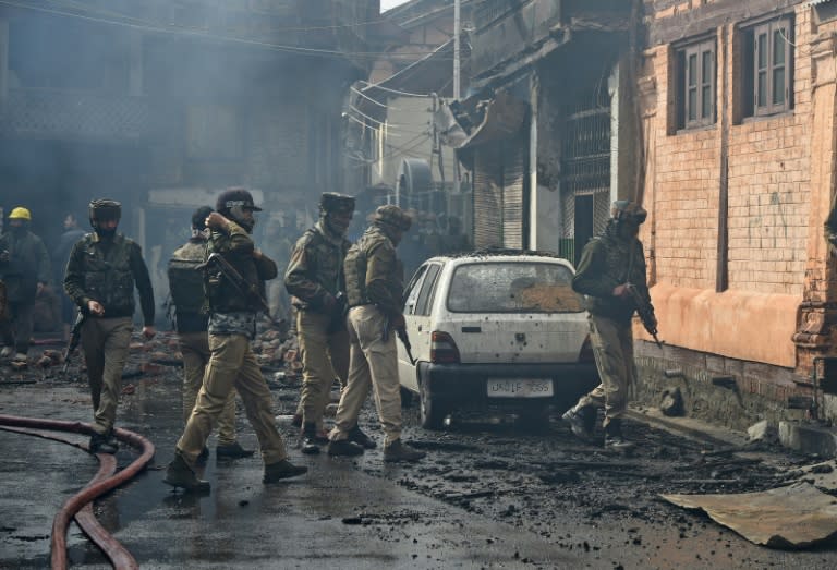 Police said three militants and a police officer were killed in the battle in streets near the Khanqah-e-Moula shrine