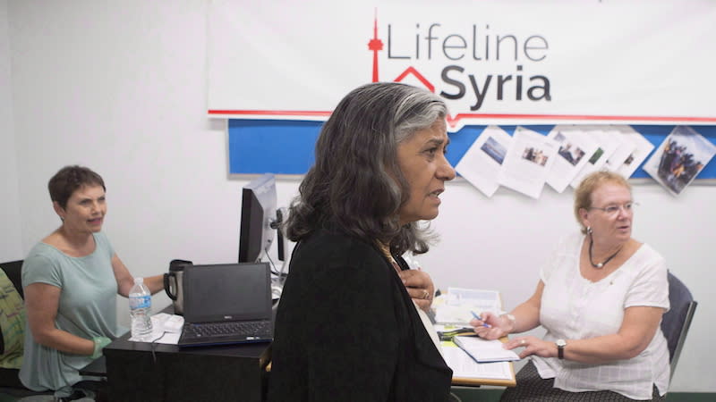 Ratna Omidvar, seen here in 2015 working with Lifeline Syria before she was a senator, says Canadians who are concerned with increasing levels of immigration should “read their history” because it’s happened before. Photo from The Canadian Press.