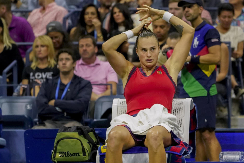 Aryna Sabalenka,of Belarus, adjusts her hair tie during a break between games against Leylah Fernandez, of Canada, during the semifinals of the US Open tennis championships, Thursday, Sept. 9, 2021, in New York. (AP Photo/Elise Amendola)