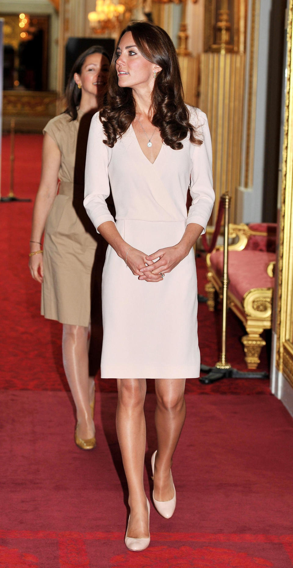 <p>Kate took a walk around the exhibits at Buckingham Palace in a pale pink dress from high street brand, Joseph. </p><p><i>[Photo: PA]</i></p>