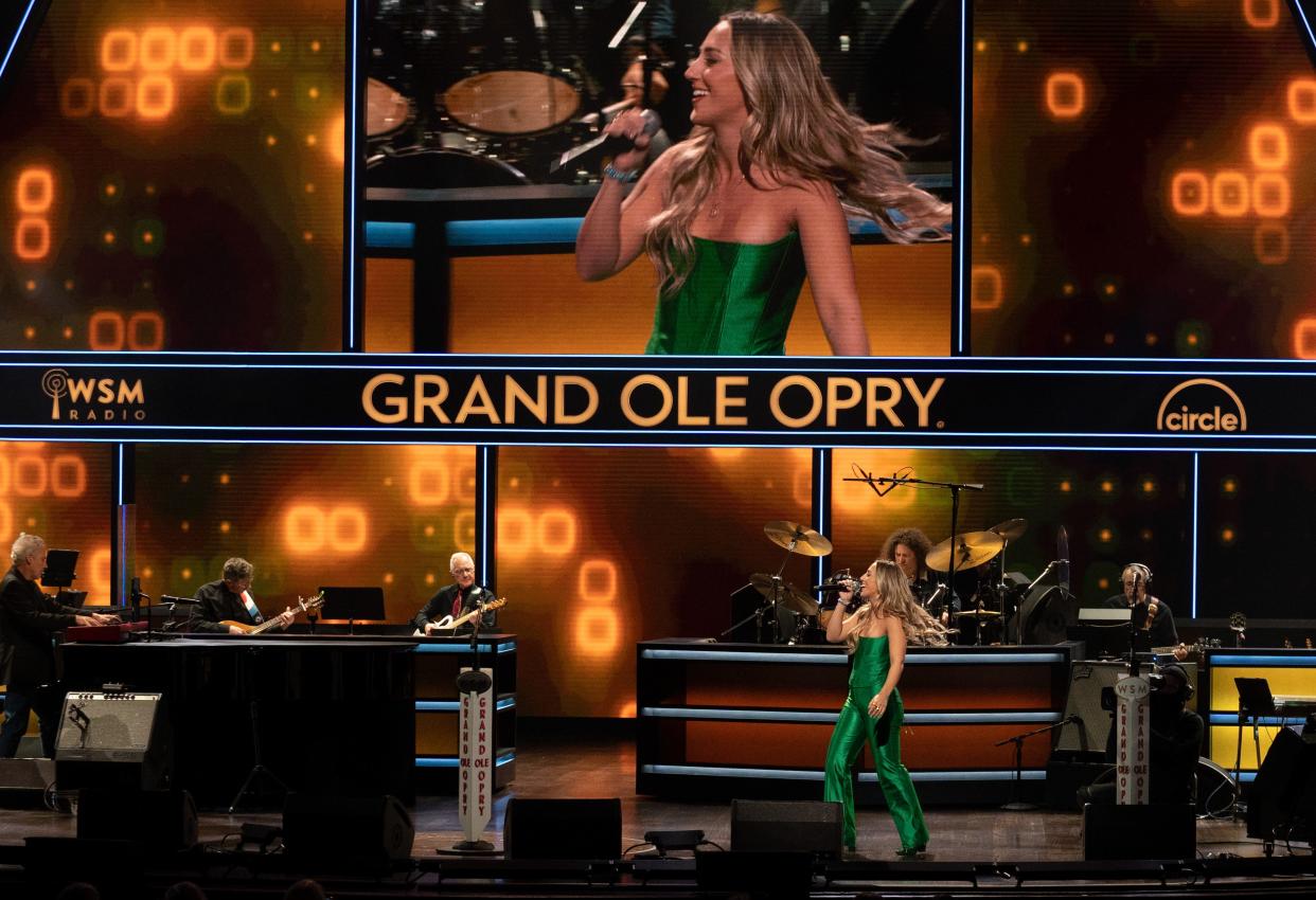 Ashley Cooke performs during the Opry NextStage Live concert hosted by Lainey Wilson at the Grand Ole Opry in Nashville, Tenn., Wednesday, Dec. 6, 2023.