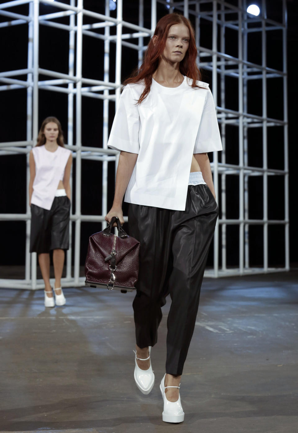 The Alexander Wang Spring 2014 collection is modeled during Fashion Week in New York, Saturday, Sept. 7, 2013. (AP Photo/Richard Drew)