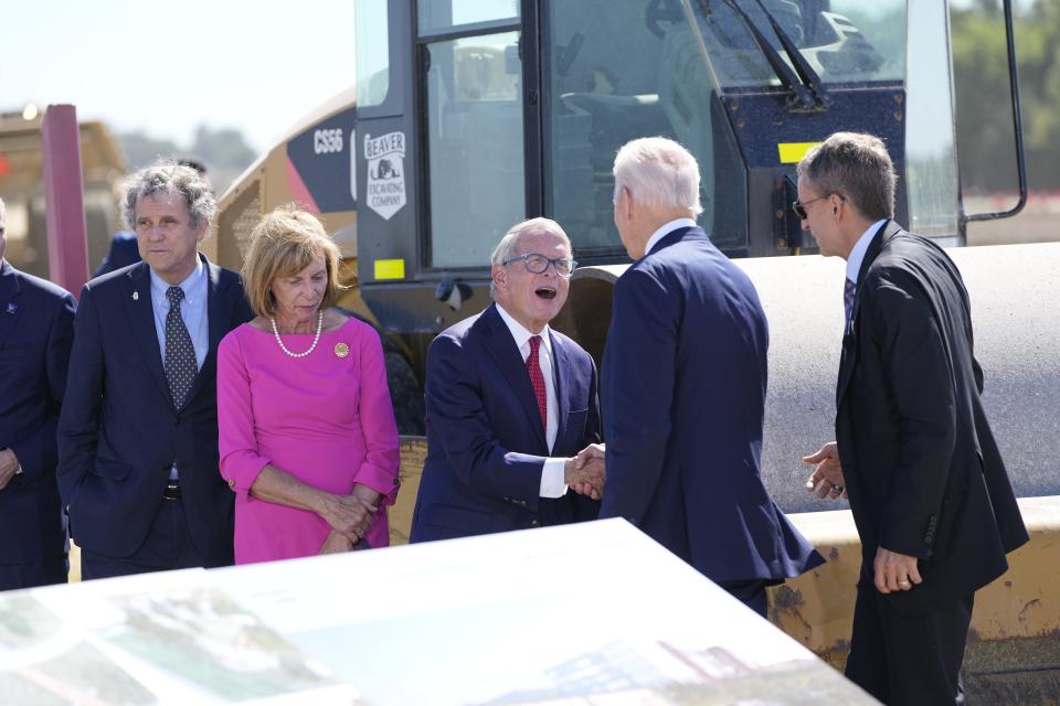 Sen. Sherrod Brown, Ohio First Lady Francis DeWine and Ohio Governor Mike DeWine line up to shake hands with President Joe Biden at a groundbreaking ceremony for Intel's $20 billion microchip manufacturing project. Adam Cairns/Columbus Dispatch