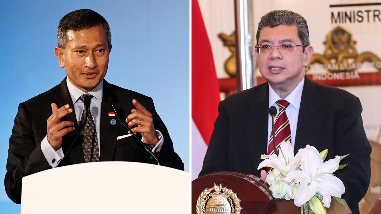 Singapore’s Minister for Foreign Affairs Dr Vivian Balakrishnan (left) and Malaysia’s Minister for Foreign Affairs Saifuddin Abdullah (right). (PHOTO: Reuters/Getty Images)