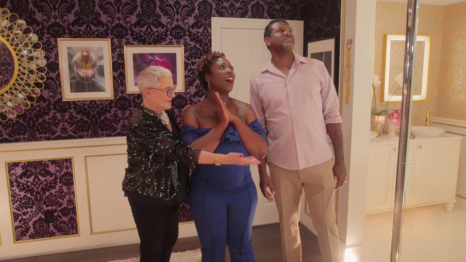 Melanie Rose shows two happy clients the finished sex room.