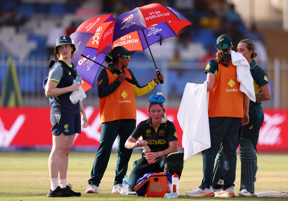 SHARJAH, UNITED ARAB EMIRATES - OCTOBER 05: Beth Mooney of Australia cools down with an ice pack in a drinks break, during the ICC Women's T20 World Cup 2024 match 5 between Australia and Sri Lanka at Sharjah Cricket Stadium on October 05, 2024 in Sharjah, United Arab Emirates. (Photo by Matthew Lewis-ICC/ICC via Getty Images)