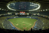 FILE - In this Sept. 29, 2004, file photo, fans watch a baseball game between the Montreal Expos and Florida Marlins at Olympic Stadium in Montreal. The Tampa Bay Rays have received permission from Major League Baseball's executive council to explore a plan that could see the team split its home games between the Tampa Bay area and Montreal, reports said Thursday, June 20, 2019. (Paul Chiasson/The Canadian Press via AP, File)