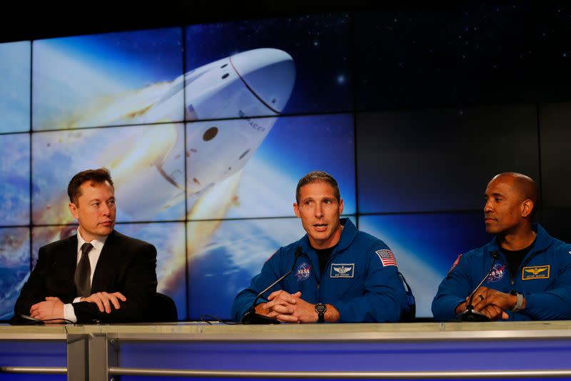 SpaceX founder and chief engineer Elon Musk listens at a post-launch news conference to discuss the SpaceX Crew Dragon astronaut capsule in-flight abort test at the Kennedy Space Center