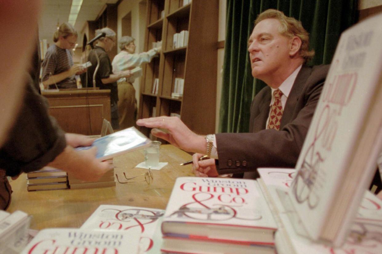 Winston Groom, author of Forrest Gump, signs copies of the sequel, Gump & Co, at a New York bookstore in 1995: AP