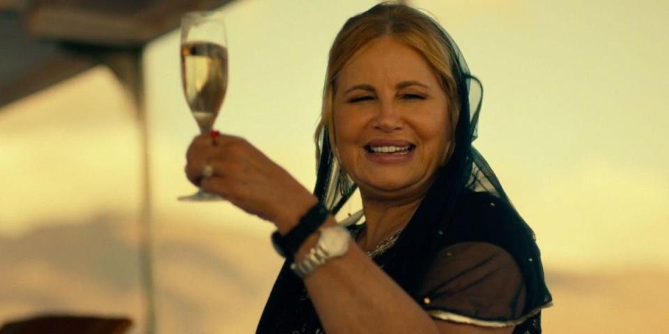 jennifer lifting a glass of champagne