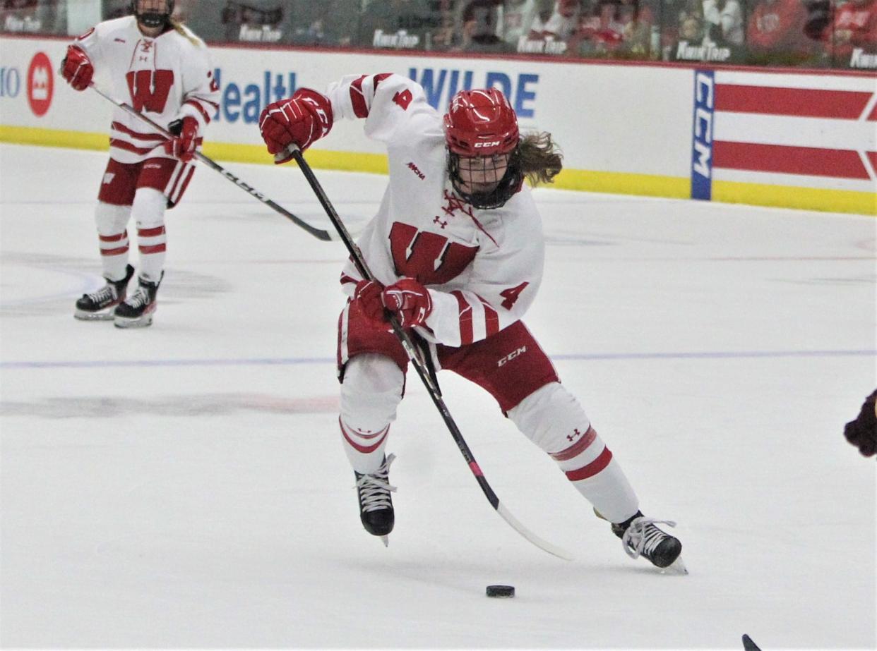 Wisconsin's Caroline Harvey controls the puck during the Badgers' 3-0 victory over Minnesota-Duluth at La Bahn Arena in Madison, Wisconsin on Saturday Dec. 2, 2023.