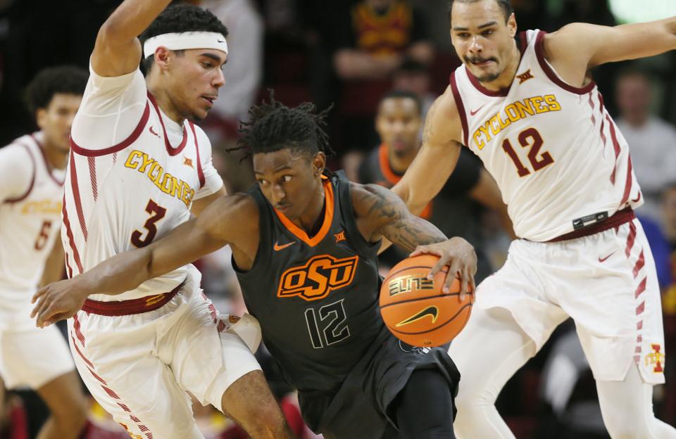 Iowa State Cyclones guard Tamin Lipsey (3) and Iowa State Cyclones forward Robert Jones (12) defend Oklahoma State Cowboys guard Javon Small (12) during a game in Jan. Defense has been the cornerstone of the Cyclones' basketball program over the last three seasons.