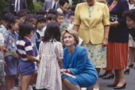 <p>Jill M. Dougherty captured this sweet moment between then-First Lady Hillary Clinton and school children in 1994. </p>