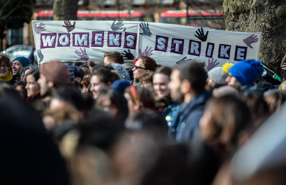 Women's rights demonstrators hold placards during a rally in Russell Square.