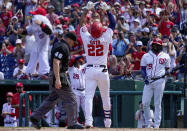 Washington Nationals' Juan Soto (22) gestures as he crosses home plate after hitting a solo home run during the third inning of a baseball game against the Colorado Rockies at Nationals Park, Sunday, Sept. 19, 2021, in Washington. (AP Photo/Andrew Harnik)