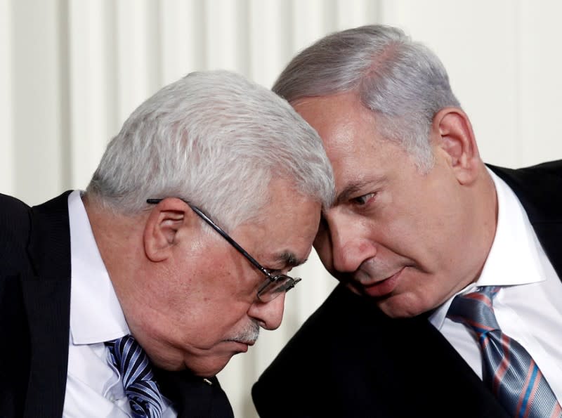 FILE PHOTO: Israeli Prime Minister Benjamin Netanyahu and Palestinian President Mahmoud Abbas speak during an event about the Middle East peace talks at the White House