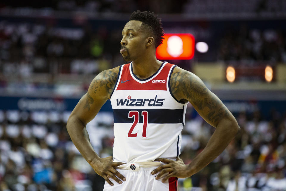 Washington Wizards center Dwight Howard (21) waits as a free throw shot is made during the first half of an NBA basketball game against the New York Knicks, Sunday, Nov. 4, 2018, in Washington. (AP Photo/Al Drago)