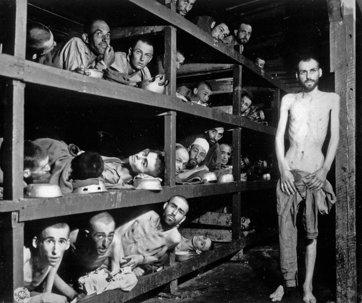 FILE - In this photo provided by the U.S. Army, inmates of the German KZ Buchenwald are seen inside their barracks a few days after U.S. troops liberated the concentration camp near Weimar, Germany on April 16, 1945.