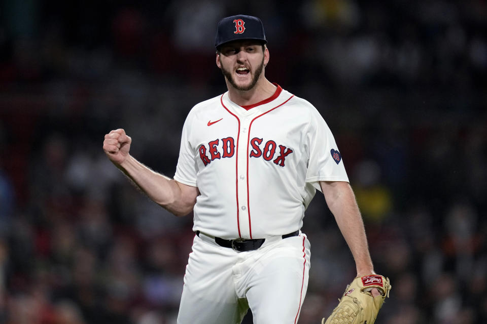 Boston Red Sox pitcher Justin Slaten pumps his fist after the Red Sox turned a double play against the Baltimore Orioles during the seventh inning of a baseball game Thursday, April 11, 2024, in Boston. (AP Photo/Charles Krupa)