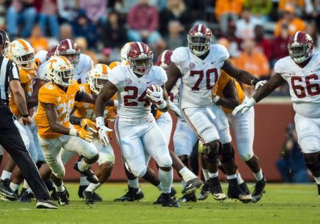 Oct 20, 2018; Knoxville, TN, USA; Alabama Crimson Tide running back Brian Robinson Jr. (24) breaks through the Tennessee Volunteers line in the fourth quarter of a game at Neyland Stadium. Alabama defeated the Vols 58-21. Mandatory Credit: Bryan Lynn-USA TODAY Sports