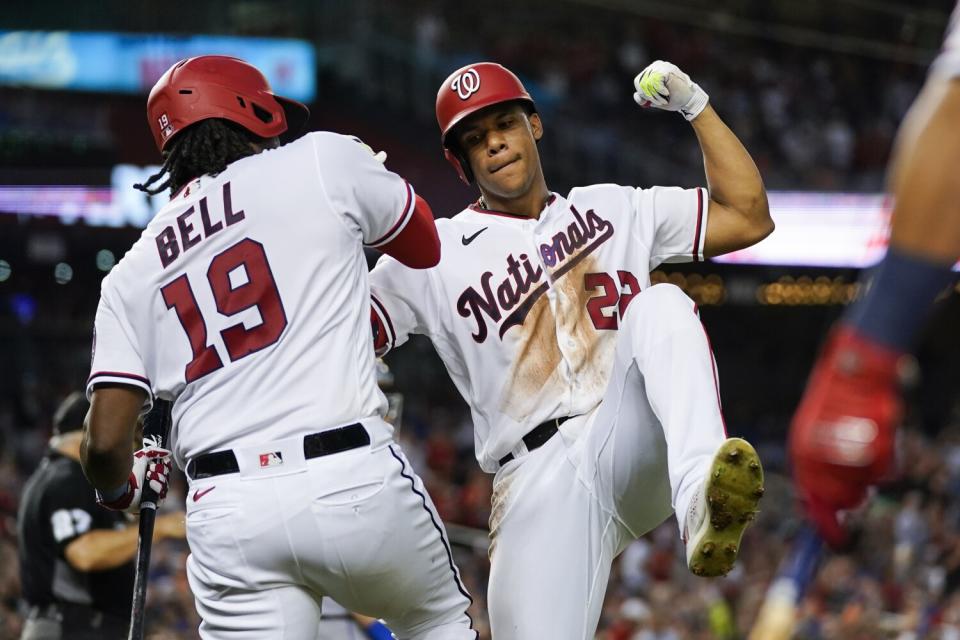 Juan Soto celebrates with Josh Bell after his solo home run against the New York Mets.