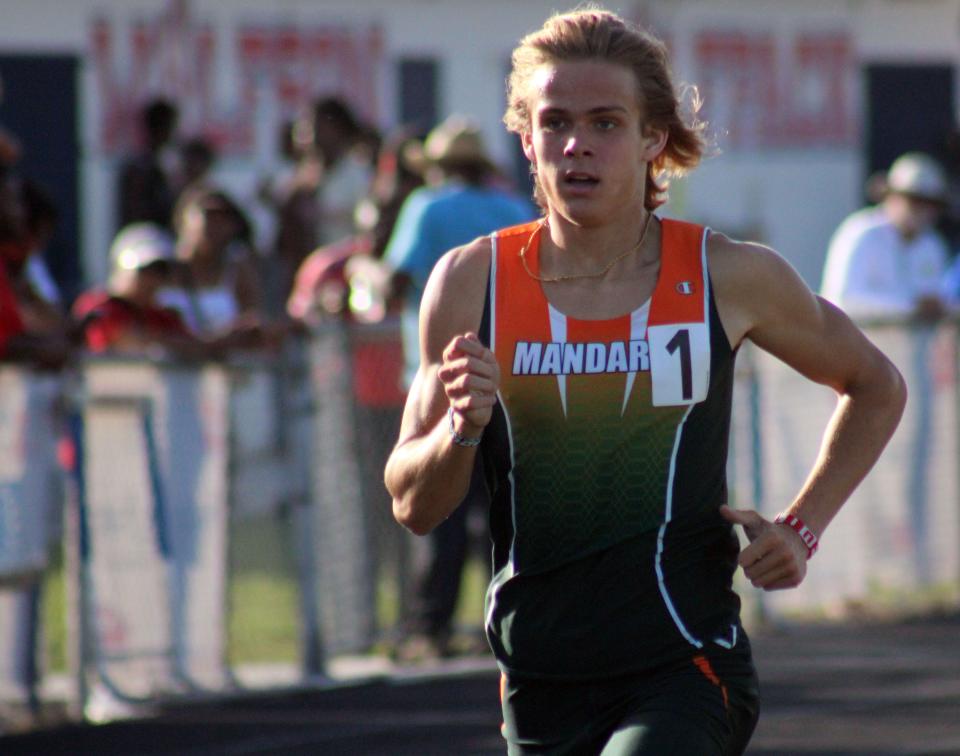Mandarin's Gavin Nelson races to victory in the boys 1,600-meter run at the Gateway Conference high school track and field meet.