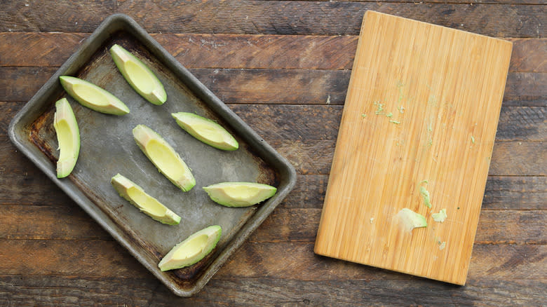 Sliced avocado on board