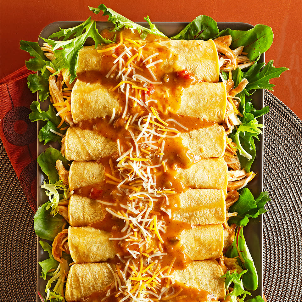 <p>These easy Mexican enchiladas are filled with flavorful, shredded slow-cooked shredded chicken. Placed on a bed of fresh lettuce, this delicious recipe is sure to be the hit of any dinner occasion. <a href="https://www.eatingwell.com/recipe/262838/easy-chicken-enchiladas/" rel="nofollow noopener" target="_blank" data-ylk="slk:View Recipe;elm:context_link;itc:0;sec:content-canvas" class="link ">View Recipe</a></p>