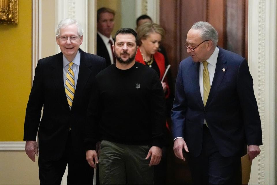 Ukrainian President Volodymyr Zelenskyy walks with Senate Majority Leader Chuck Schumer of N.Y. and Senate Minority Leader Mitch McConnell of Ky. during a visit to Capitol Hill in Washington on Dec. 12, 2023.