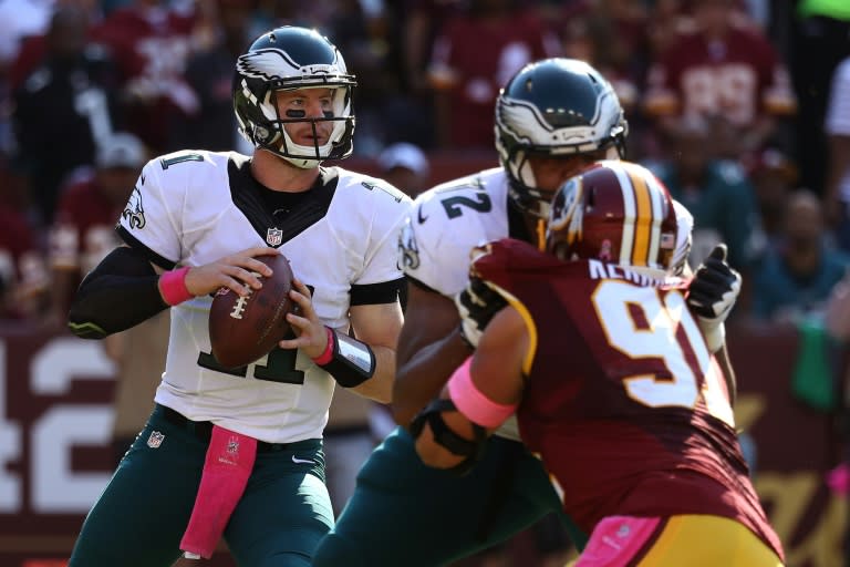 Quarterback Carson Wentz of the Philadelphia Eagles looks to pass the ball during their game against the Washington Redskins, at FedEx Field in Landover, Maryland, on October 16, 2016