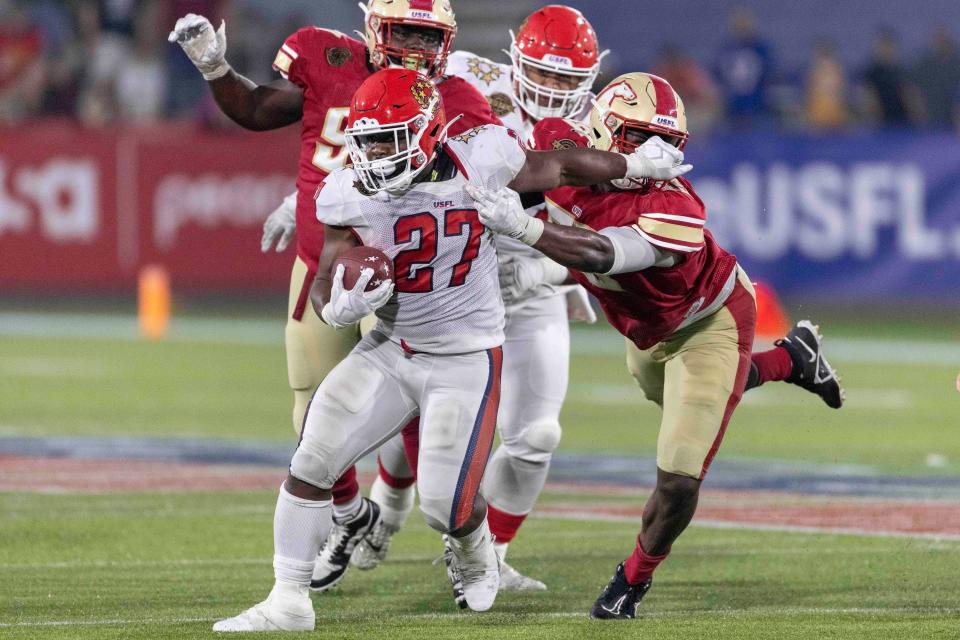 New Jersey Generals running back Darius Victor (27) runs the ball against the Birmingham Stallions, April 16, 2022, in Birmingham.