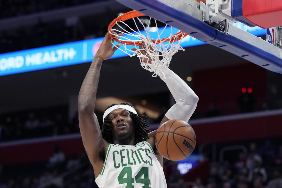 Boston Celtics center Robert Williams III (44) dunks during the first half of an NBA basketball game against the Detroit Pistons, Monday, Feb. 6, 2023, in Detroit. (AP Photo/Carlos Osorio)