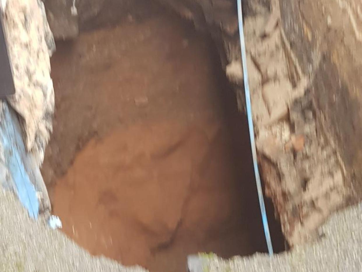 The sinkhole opened up in an alley behind Sainsbury's in the centre of Ripon, North Yorkshire: Harrogate Borough Council