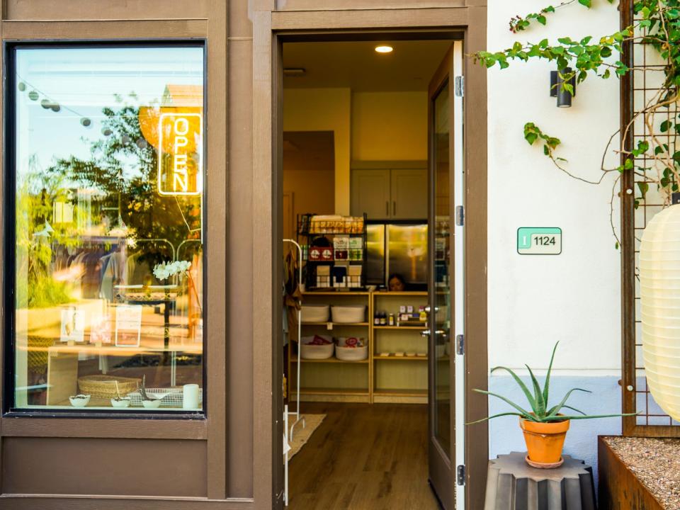 Culdesac Tempe: A storefront with a brown, open door showing inside