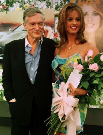 Newly-named Playboy Playmate of the Year Karen McDougal poses with Playboy magazine founder and editor in chief Hugh Hefner May 28 at ceremonies held at the Playboy Mansion in Beverly Hills, Ca.The Indiana native will be featured in the July issue of the magazine. SSM/RC/File Photo