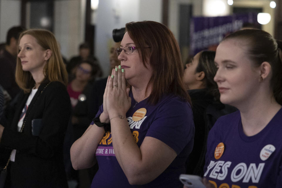 A supporter holds her breath as preliminary results for Michigan Proposal 3 are announced at a watch party in Detroit, Mich., on Election Day, Tuesday, Nov. 8, 2022. Abortion rights supporters won in the four states where access was on the ballot Tuesday, as voters enshrined it into the state constitution in battleground Michigan as well as blue California and Vermont and dealt a defeat to an anti-abortion measure in deep-red Kentucky. (Ryan Sun/Ann Arbor News via AP)