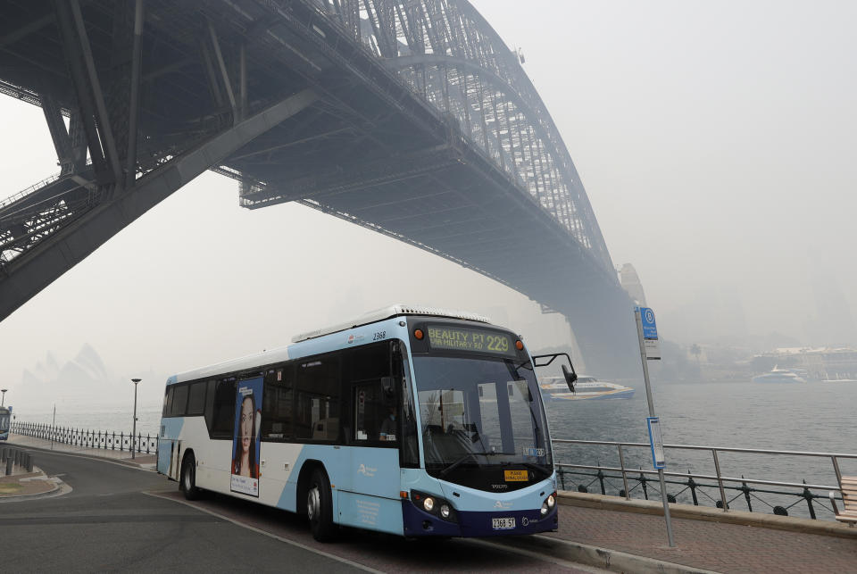 Thick smoke from wildfires shroud the Harbour Bridge in Sydney, Australia, Tuesday, Dec. 10, 2019. Hot dry conditions have brought an early start to the fire season. (AP Photo/Rick Rycroft)