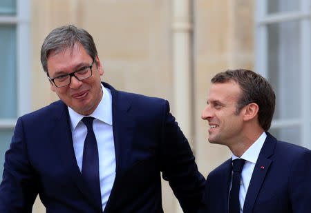 FILE PHOTO: French President Emmanuel Macron accompanies Serbian President Aleksandar Vucic after a meeting at the Elysee Palace in Paris, France, July 17, 2018. REUTERS/Gonzalo Fuentes